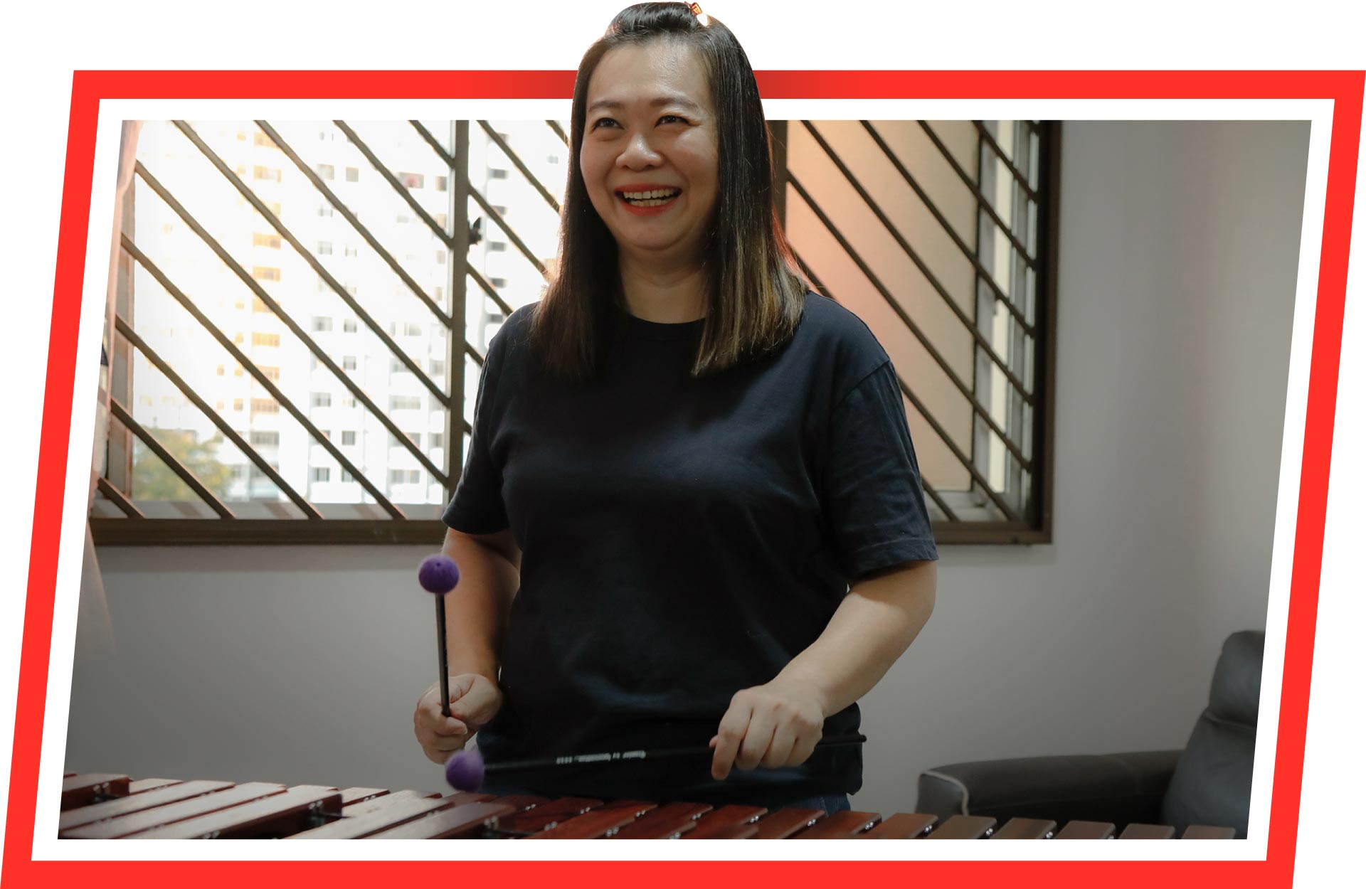 Lily Goh playing the xylophone